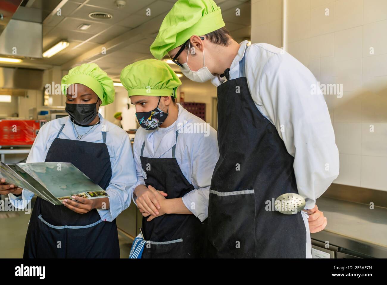 chef students studying the menu to prepare Stock Photo