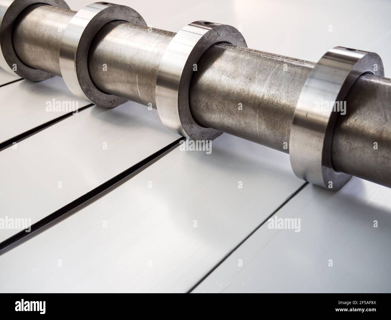 Sheet metal slitting machine in operation Stock Photo Alamy