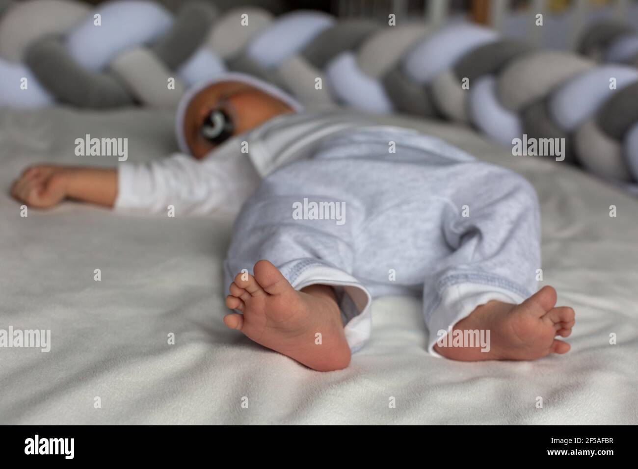Newborn baby sleeps, legs closeup Stock Photo Alamy