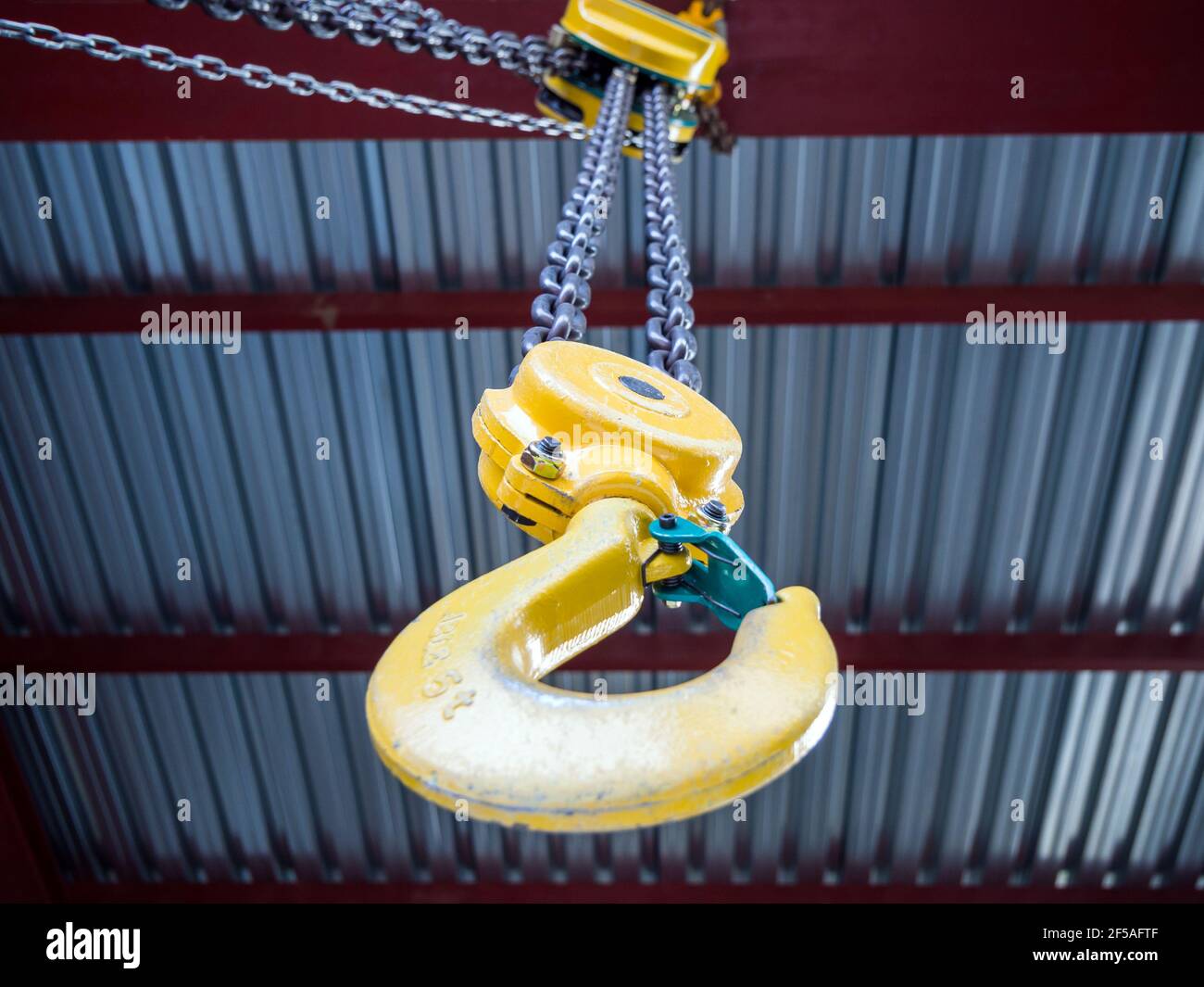 Hook of a hand loader under the ceiling of a building Stock Photo