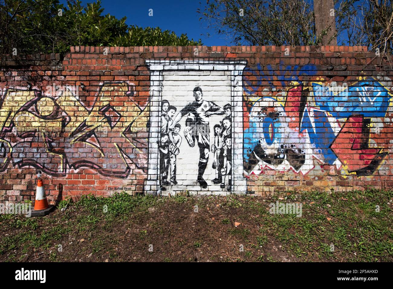 A mural depicting Marcus Rashford kicking down the door to No10 Downing Street. Old Trafford, Manchester, UK. Stock Photo