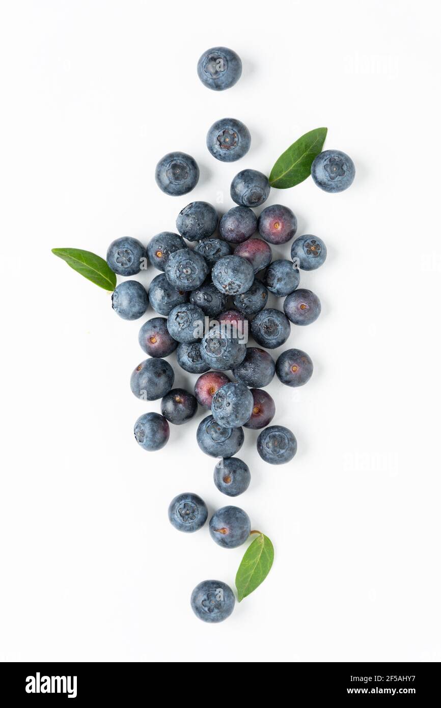 Fresh blueberries background top view. Blueberry berries with water drops. Summertime. Stock Photo
