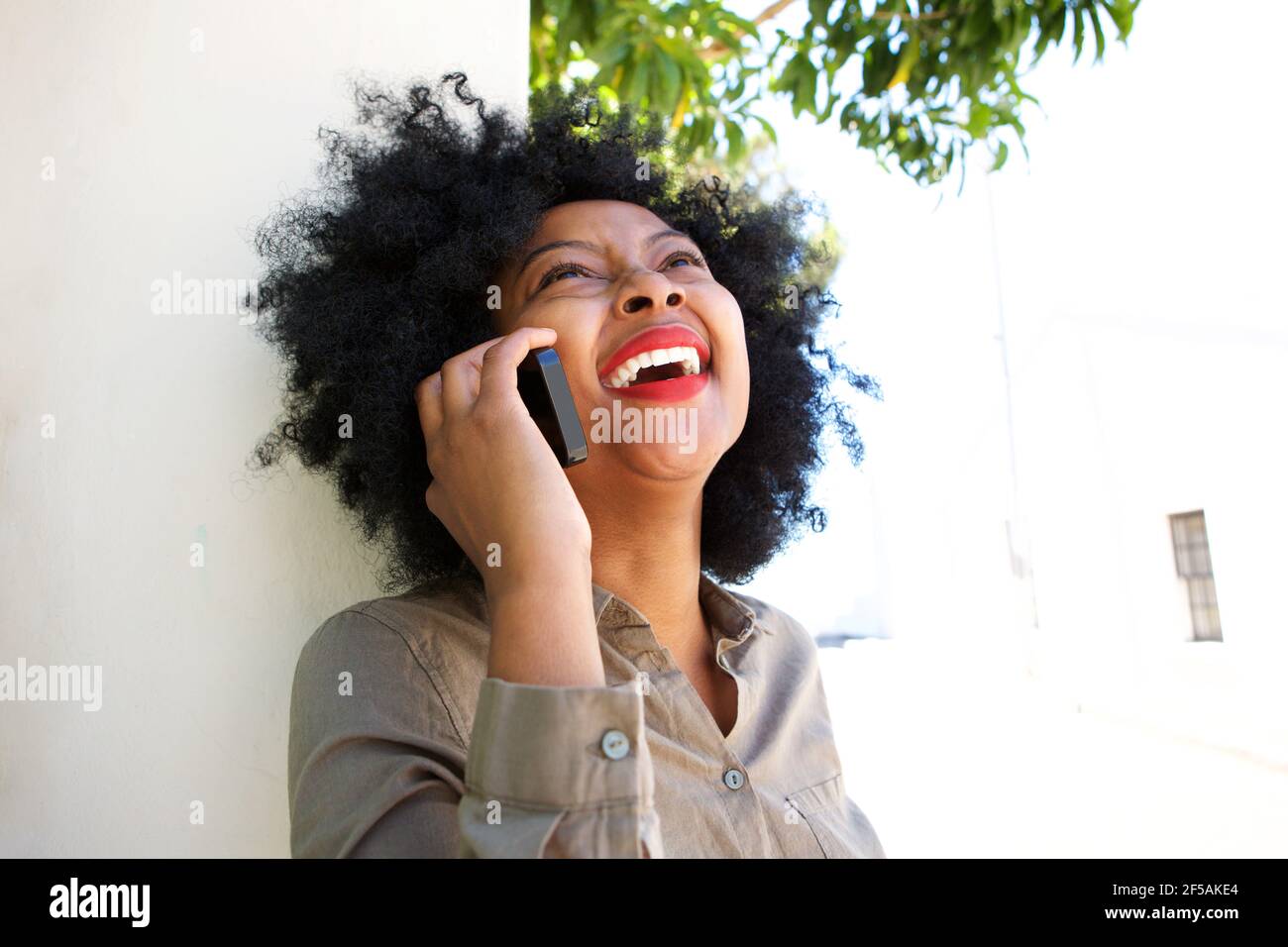 Black woman talking laughing hi-res stock photography and images - Alamy