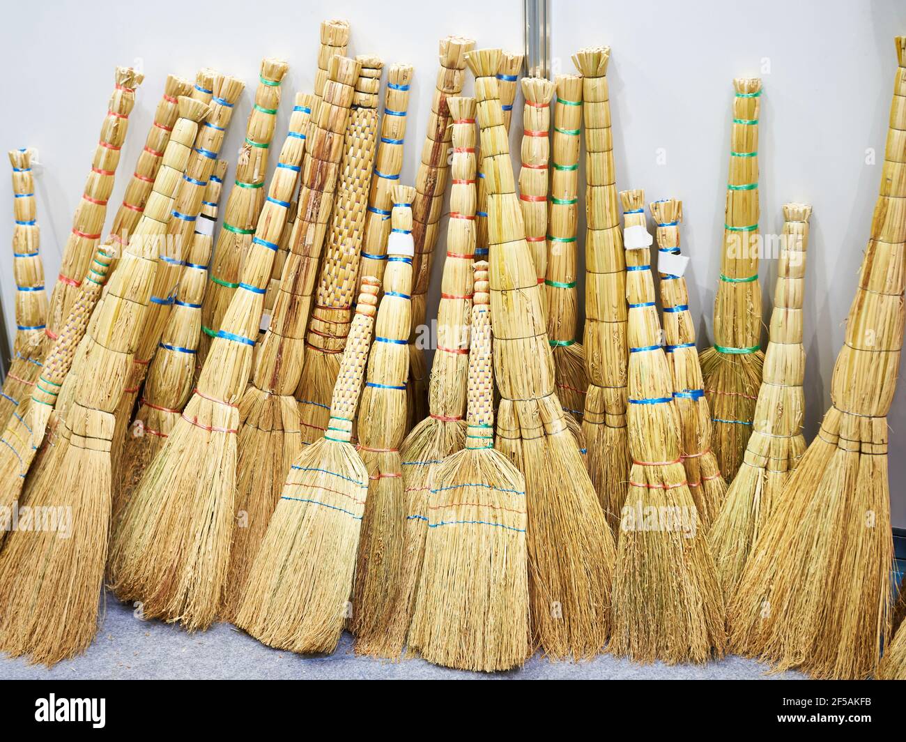 Besoms as household implement in the store Stock Photo