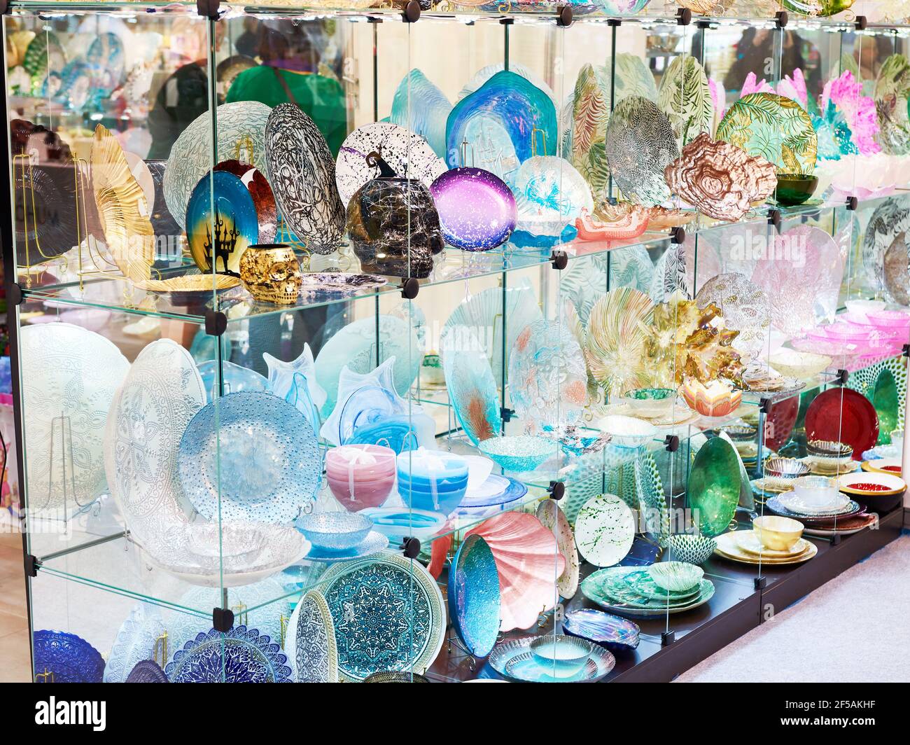 Decorative colored glass dishes in the store Stock Photo Alamy