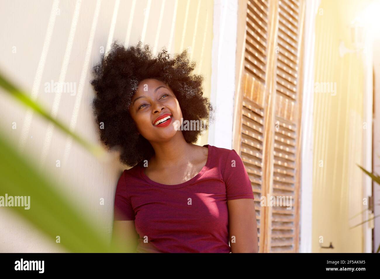 Woman standing outside house hi-res stock photography and images - Alamy