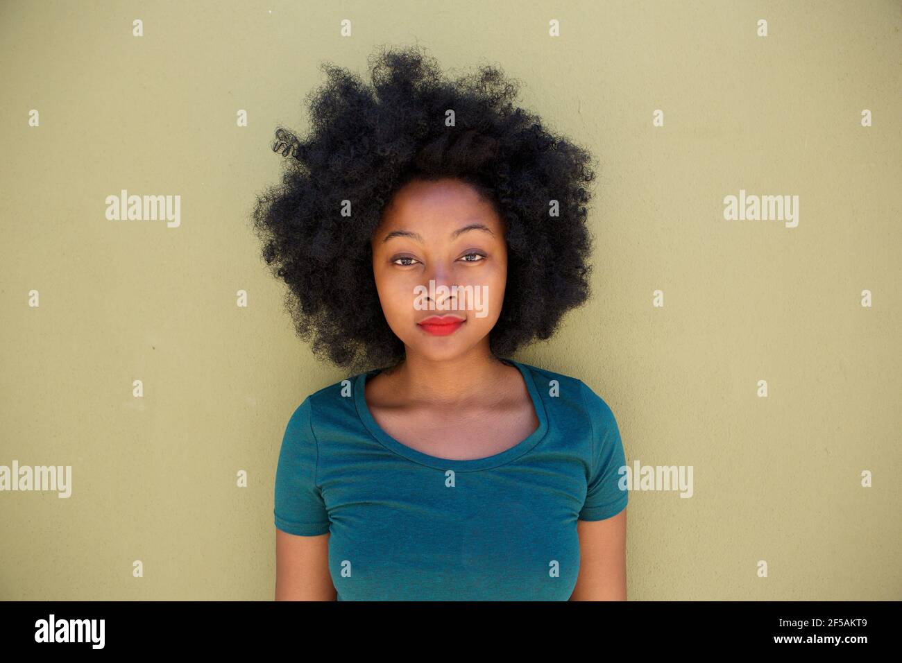 Serious black woman with afro hi-res stock photography and images - Alamy