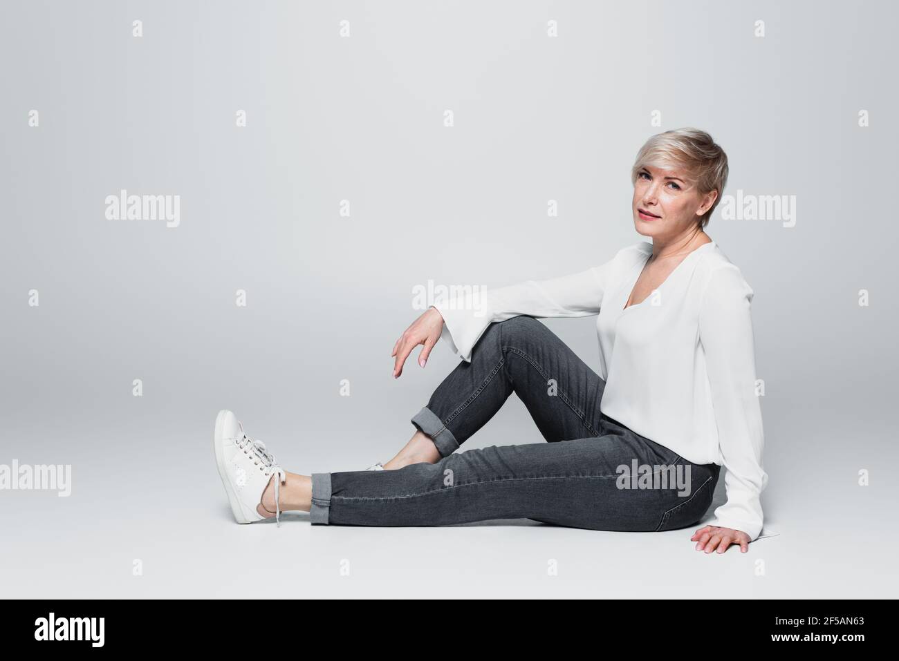 Woman denim jeans full length mature hi-res stock photography and ...