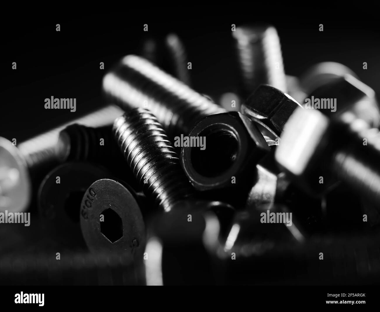 Close-up of various steel nuts and bolts Stock Photo