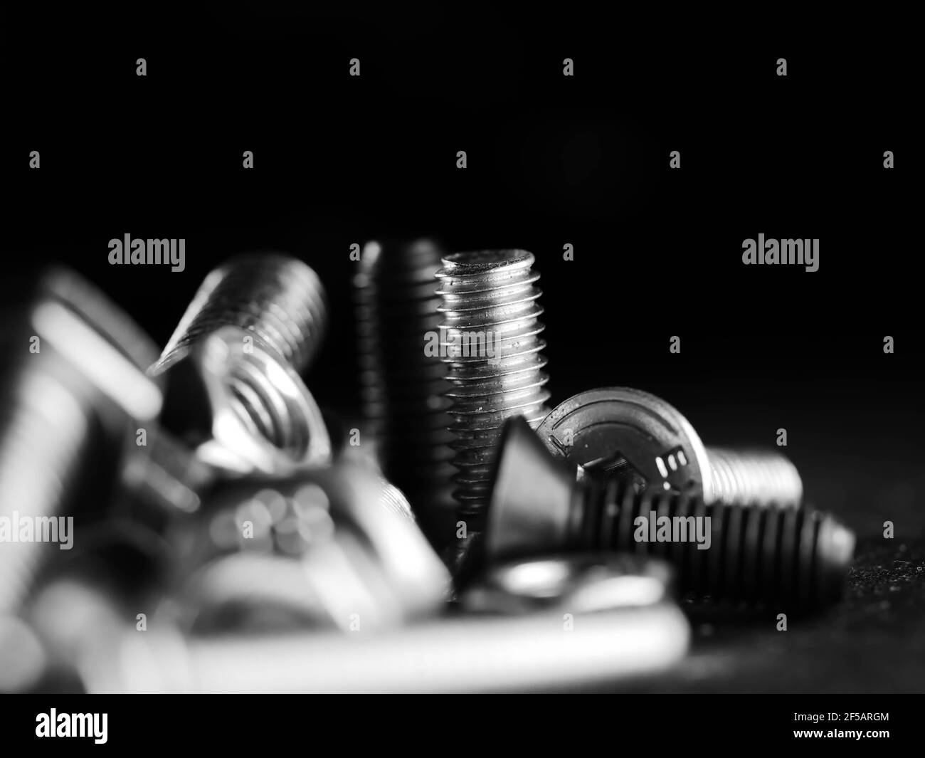 Close-up of various steel nuts and bolts Stock Photo