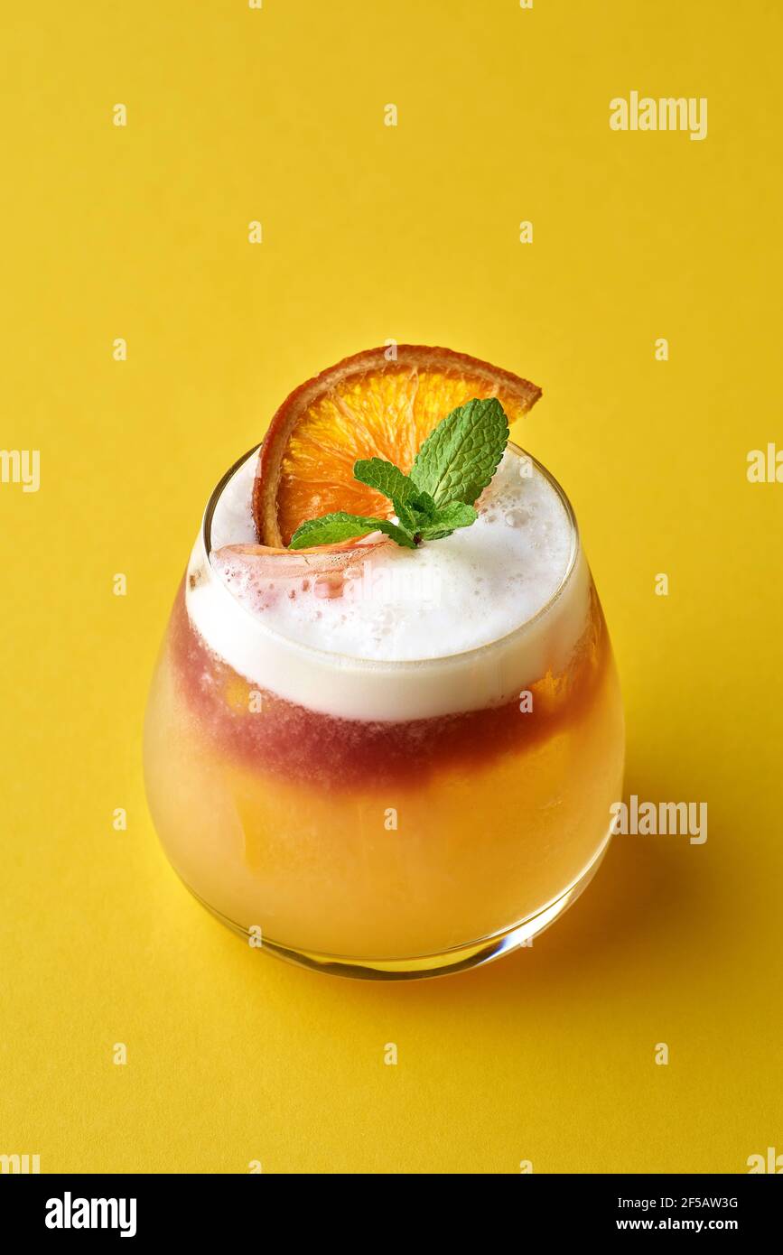 Refreshment baileys creamy cocktail in misted glass with ice cubes