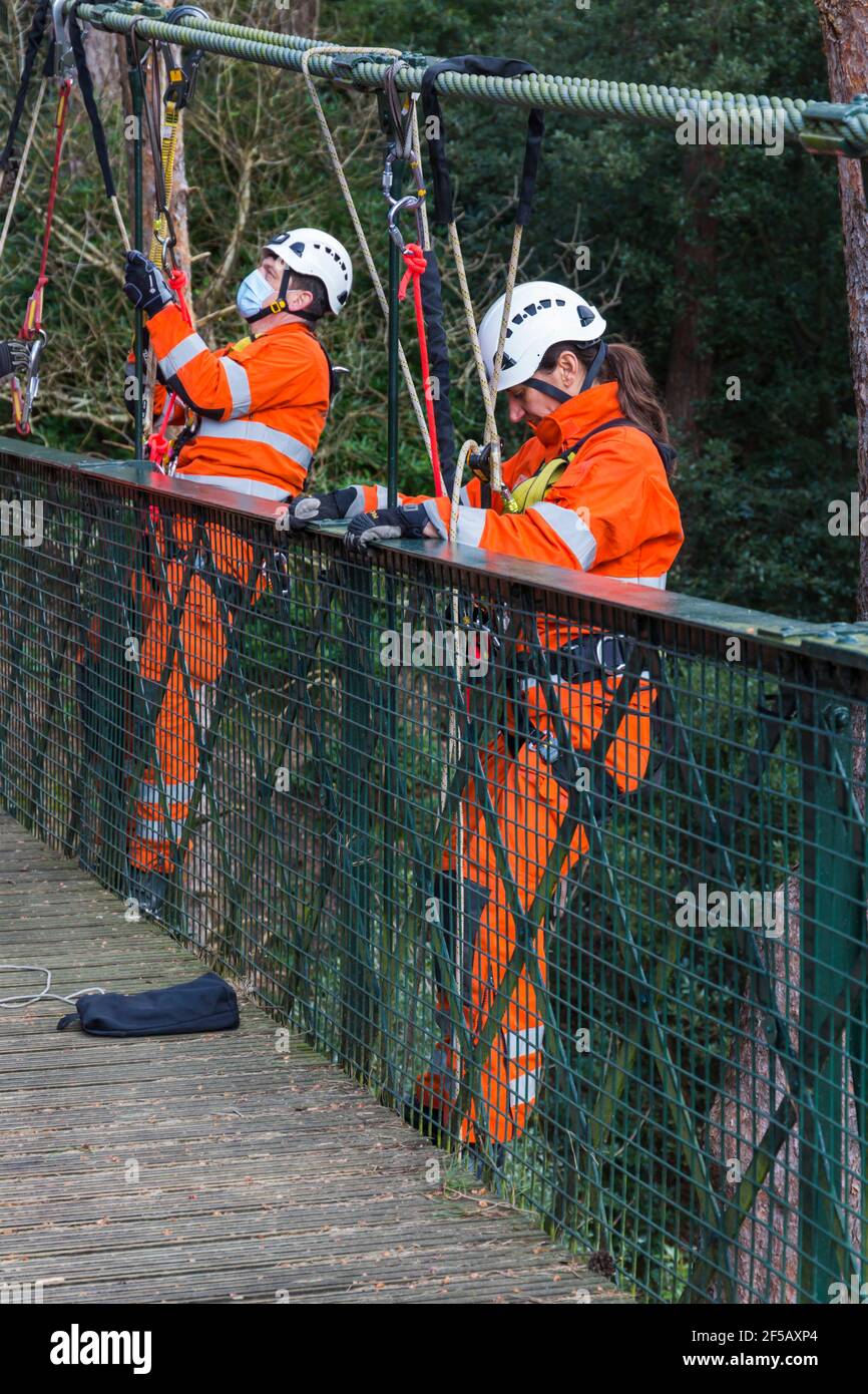 Dorset Fire Service carrying out training exercise on suspension bridge at Alum Chine, Bournemouth, Dorset UK in March during Covid-19 lockdown Stock Photo