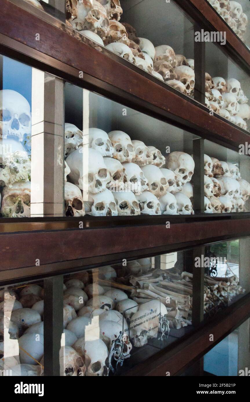 Skulls displayed in a showcase - all victims of politically motivated mass murders by the Khmer Rouge in Cambodia Stock Photo
