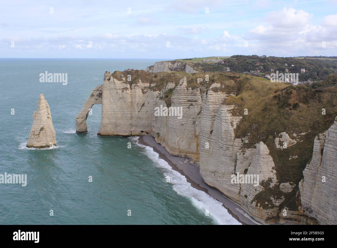 the beautiful white cliffs of the alabaster coast in etretat, france in ...