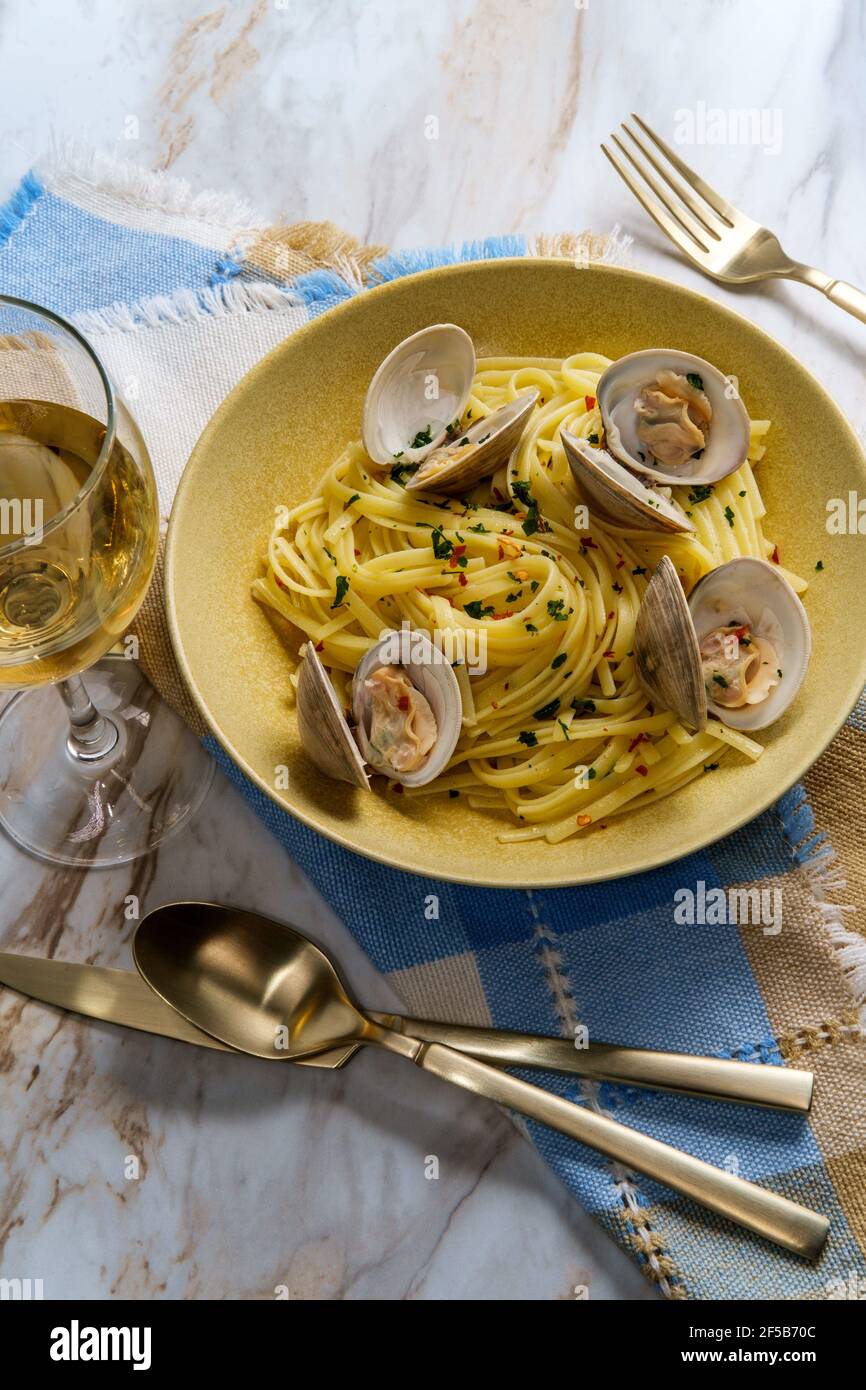 Linguine with littleneck white wine clam sauce and parsley garnish