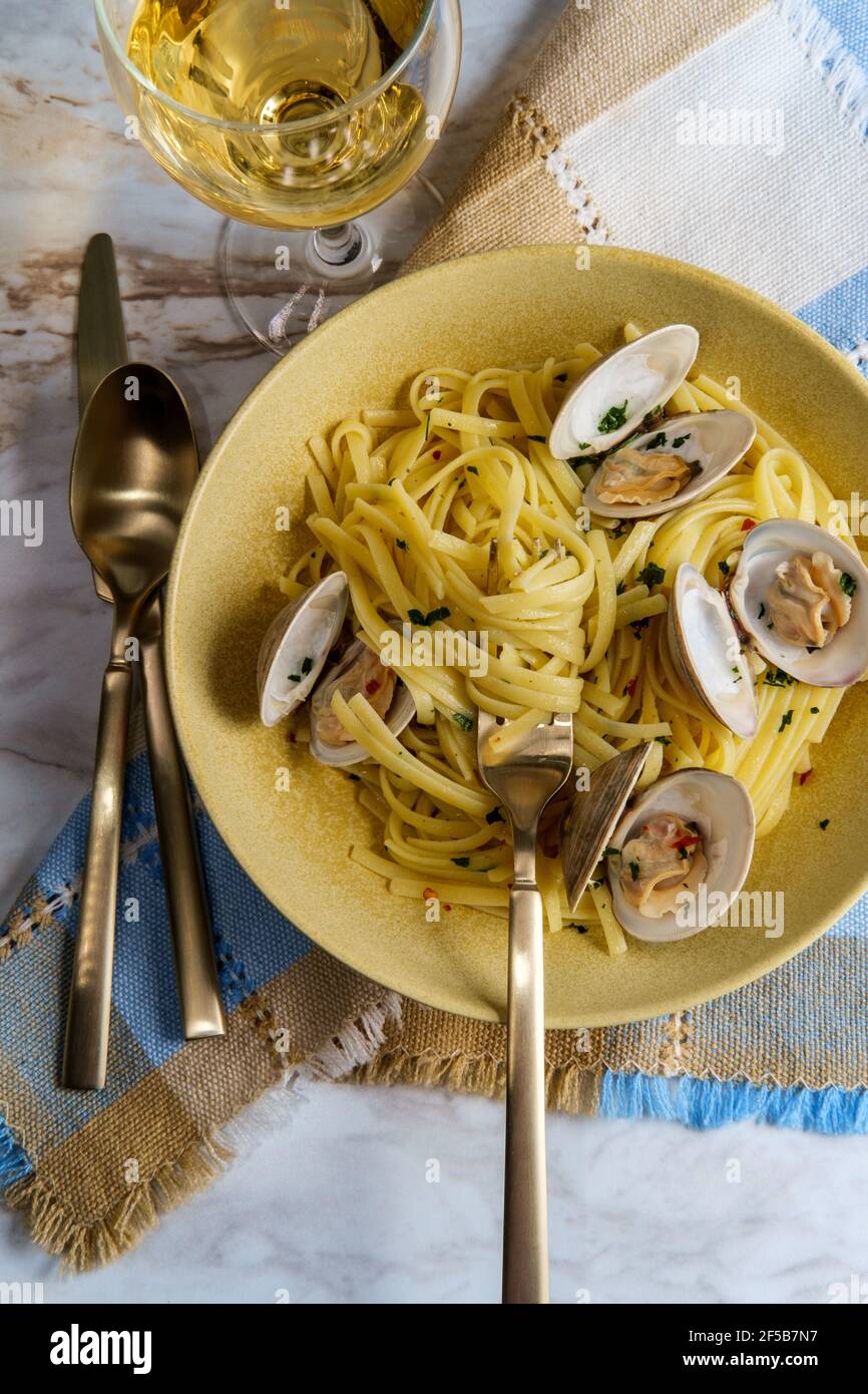 Linguine with littleneck white wine clam sauce and parsley garnish