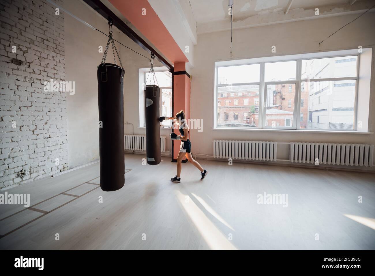 Female MMA fighter training punches technique Stock Photo Alamy