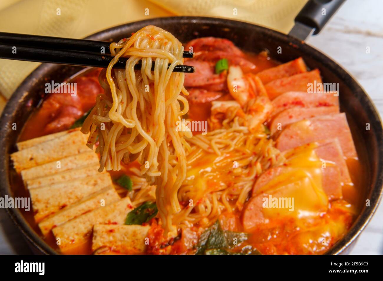 Korean comfort food army base stew also known as Budae-jjigae with sausage tofu and canned ham Stock Photo