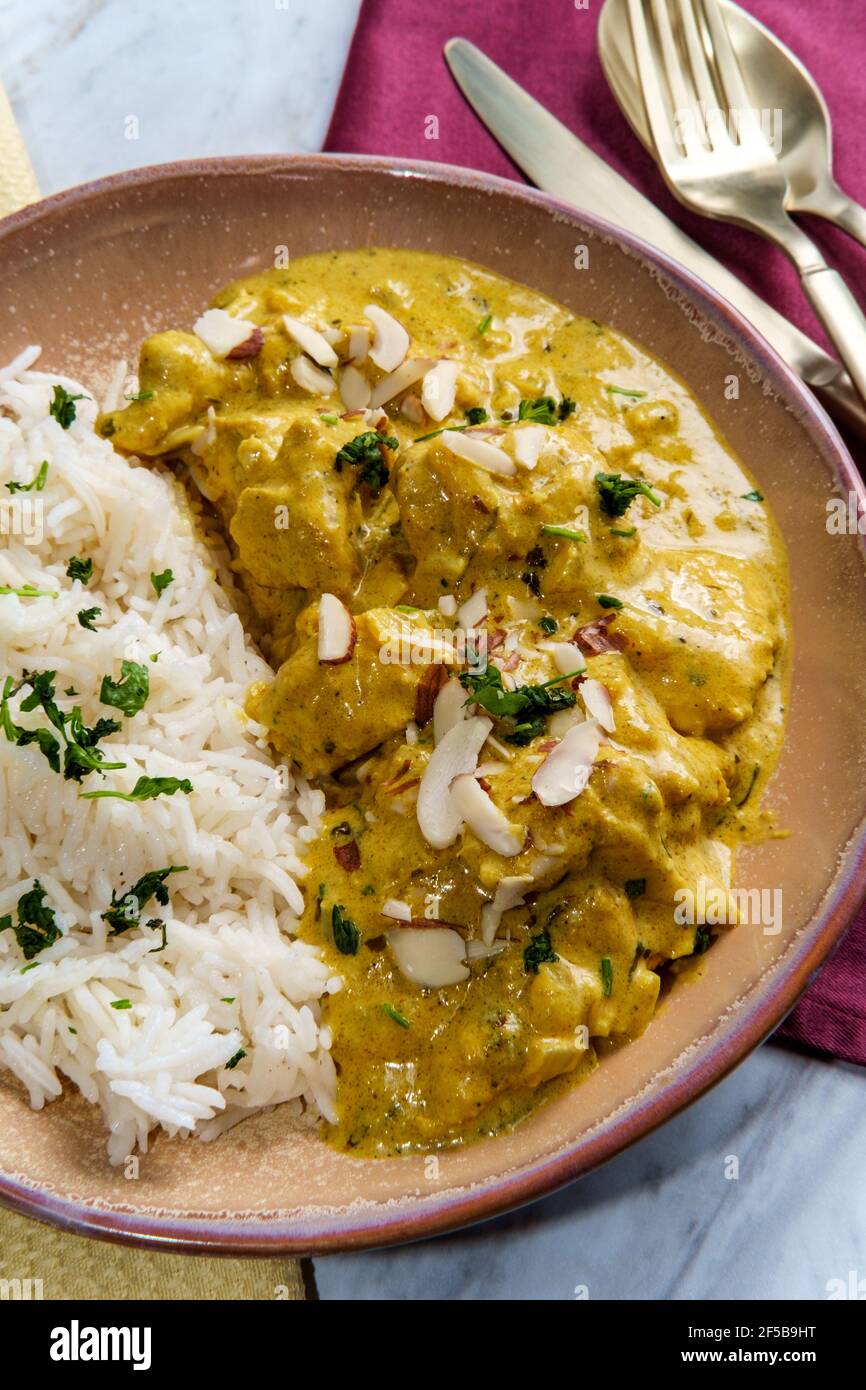 Authentic Indian chicken korma curry with jasmine rice Stock Photo Alamy
