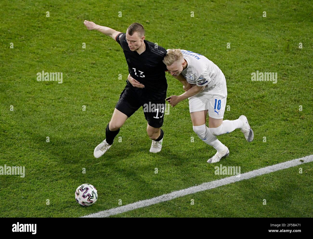 Soccer Football - World Cup Qualifiers Europe - Group J - Germany v Iceland - MSV-Arena, Duisburg, Germany - March 25, 2021 Germany's Lukas Klostermann in action with Iceland's Hordur Magnusson Pool via REUTERS/Tobias Schwarz Stock Photo