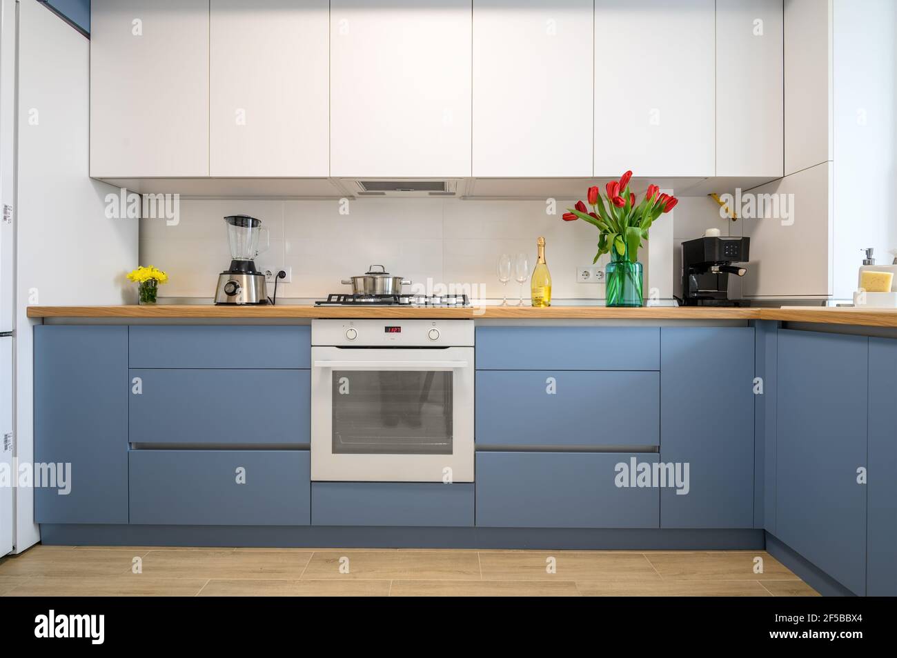 Modern blue-teal kitchen interior, furniture front view Stock Photo