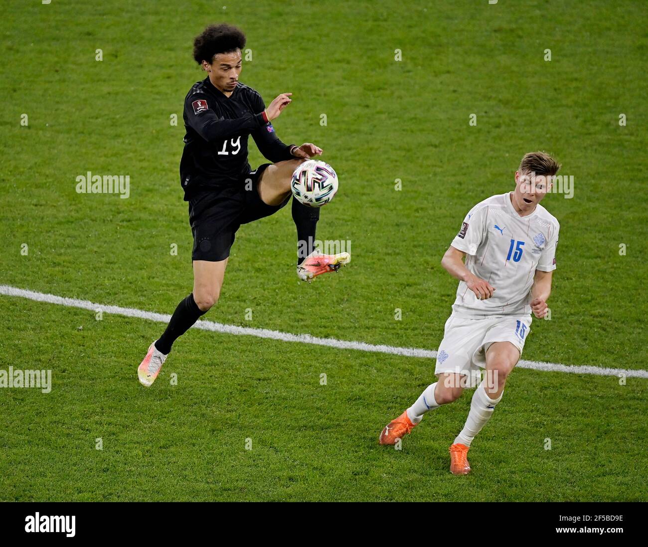 Soccer Football - World Cup Qualifiers Europe - Group J - Germany v Iceland - MSV-Arena, Duisburg, Germany - March 25, 2021 Germany's Leroy Sane in action with Iceland's Alfons Sampsted REUTERS/Tobias Schwarz Stock Photo