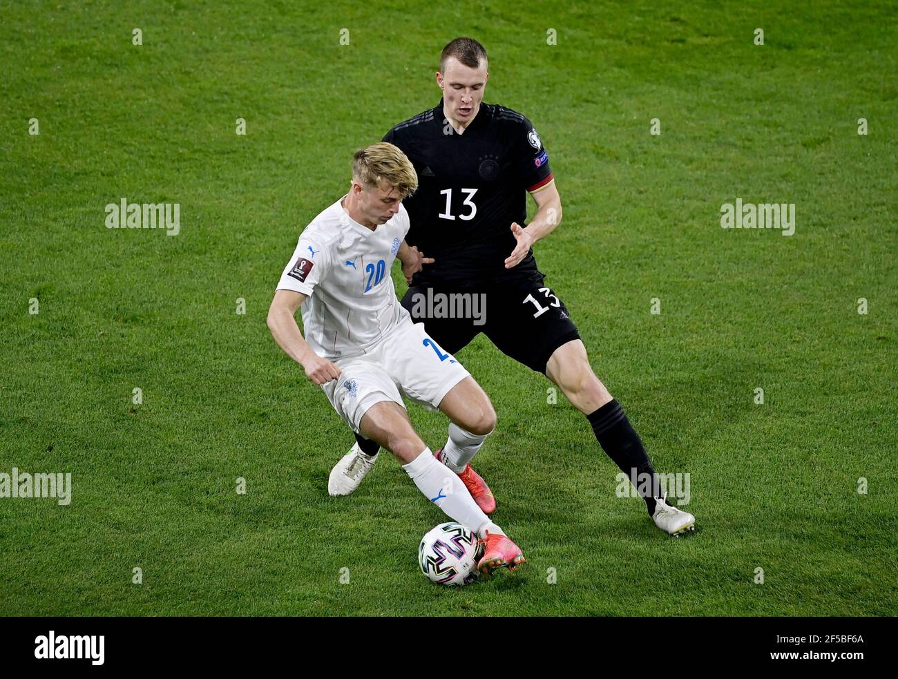 Soccer Football - World Cup Qualifiers Europe - Group J - Germany v Iceland - MSV-Arena, Duisburg, Germany - March 25, 2021 Iceland's Albert Gudmundsson in action with Germany's Lukas Klostermann REUTERS/Tobias Schwarz Stock Photo