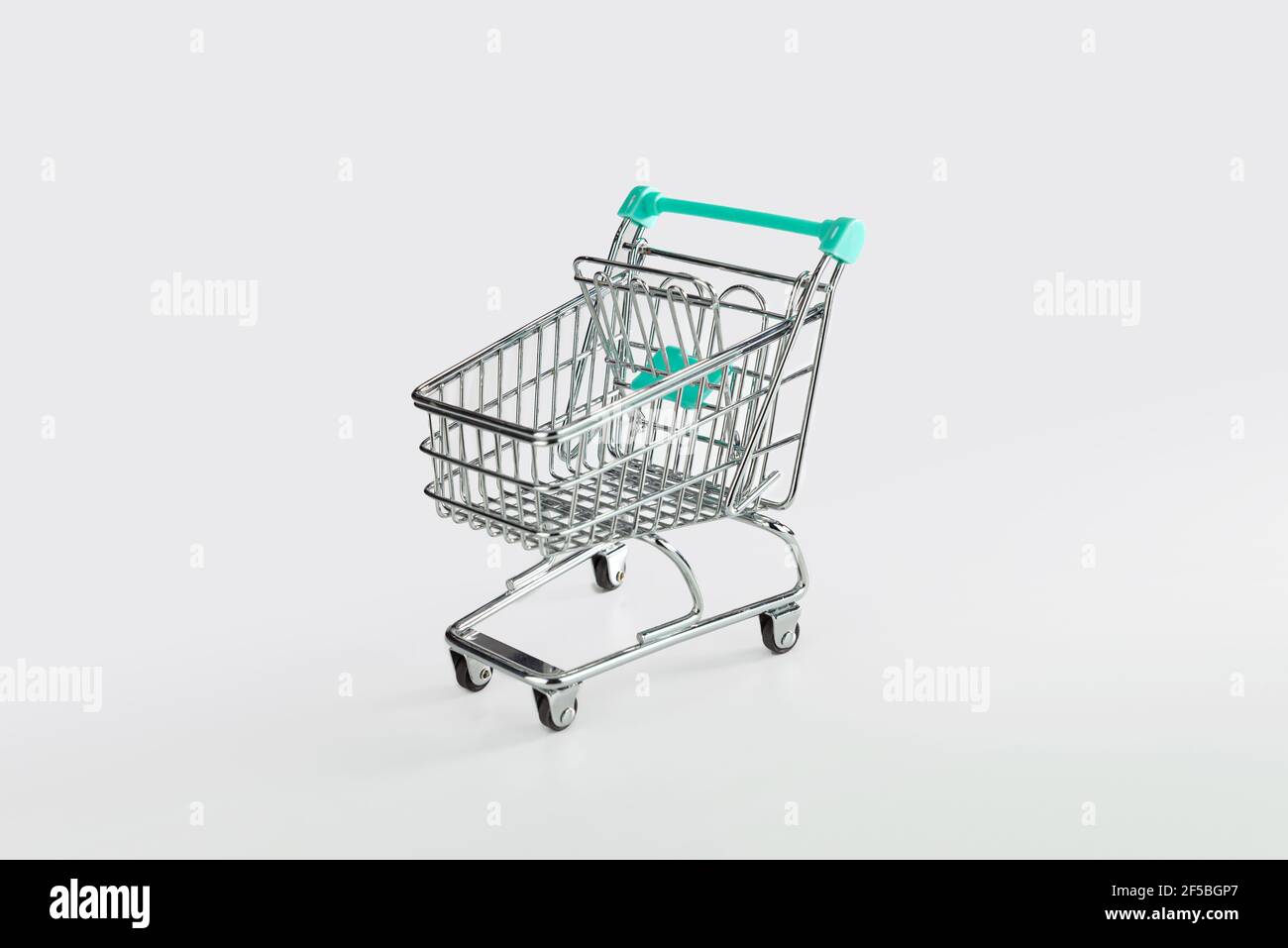 empty shopping trolley isolated on white background, copy space Stock Photo