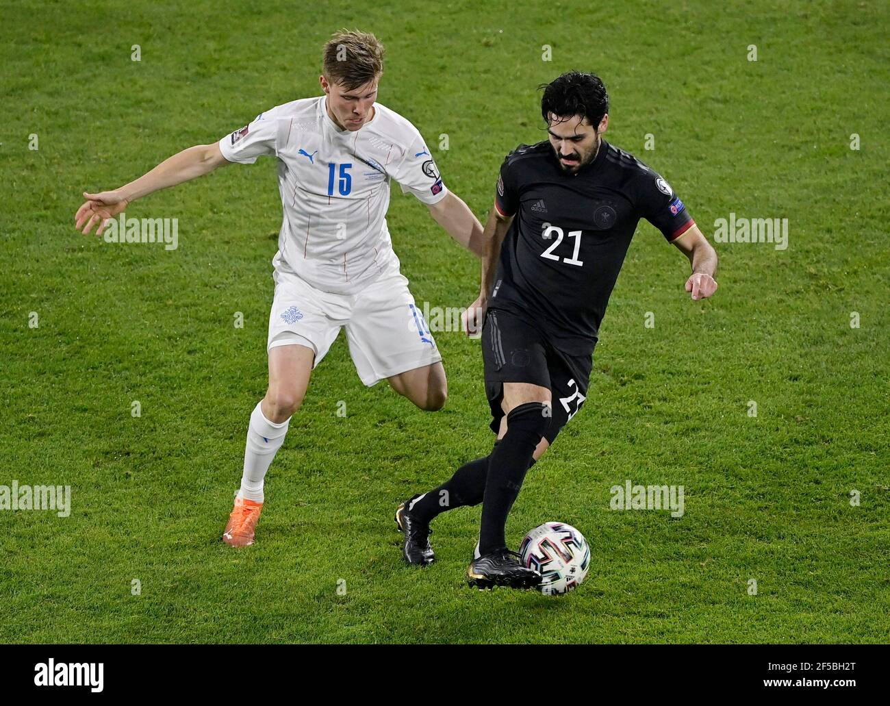 Soccer Football - World Cup Qualifiers Europe - Group J - Germany v Iceland - MSV-Arena, Duisburg, Germany - March 25, 2021 Iceland's Alfons Sampsted in action with Germany's Ilkay Gundogan REUTERS/Tobias Schwarz Stock Photo