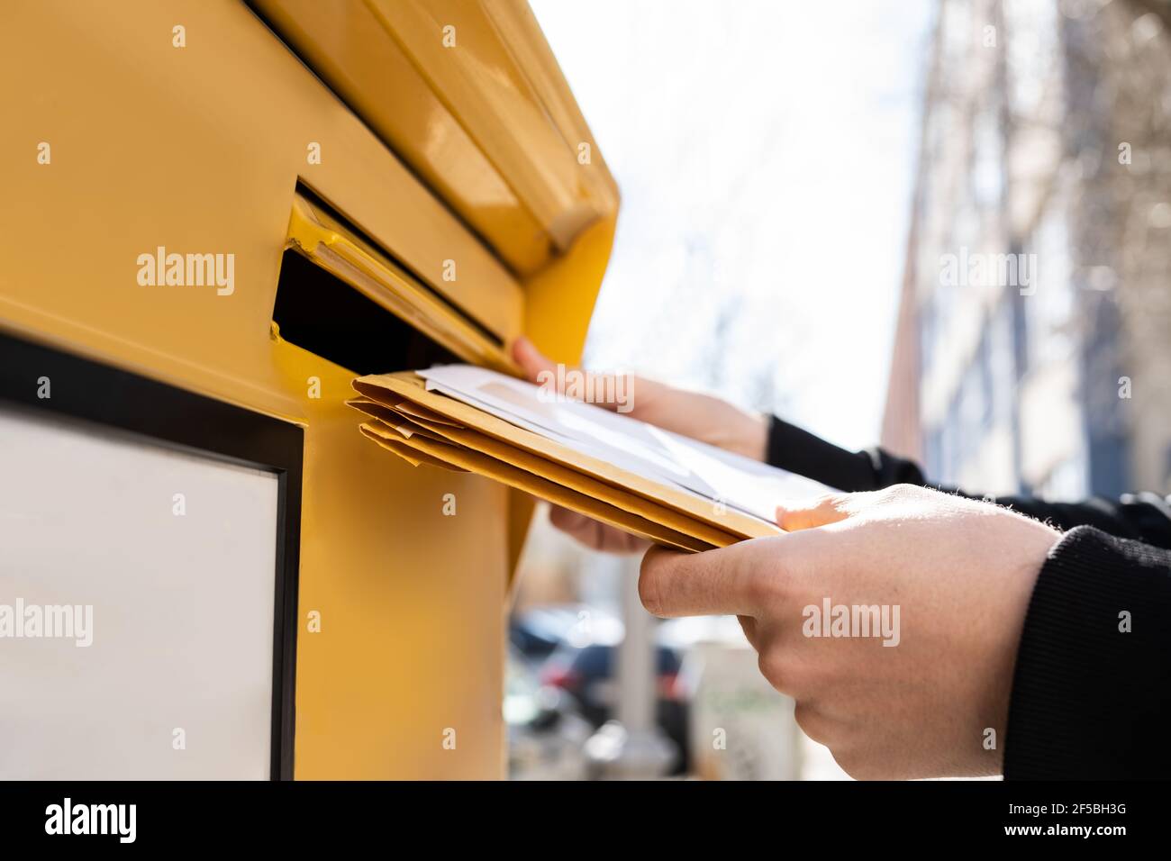 Letter In Envelope Or Document In Mailbox. Man Hand Sending Mail Stock
