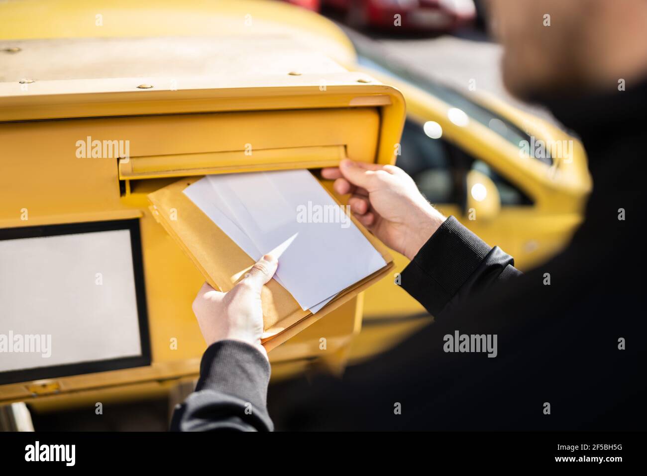 Letter In Envelope Or Document In Mailbox. Man Hand Sending Mail Stock  Photo - Alamy
