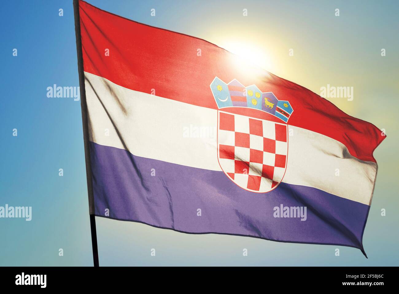 Croatia flag waving on the wind in front of sun Stock Photo