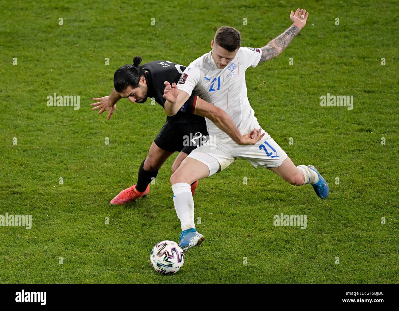 Soccer Football - World Cup Qualifiers Europe - Group J - Germany v Iceland - MSV-Arena, Duisburg, Germany - March 25, 2021 Germany's Emre Can in action with Iceland's Arnor Traustason REUTERS/Tobias Schwarz Stock Photo