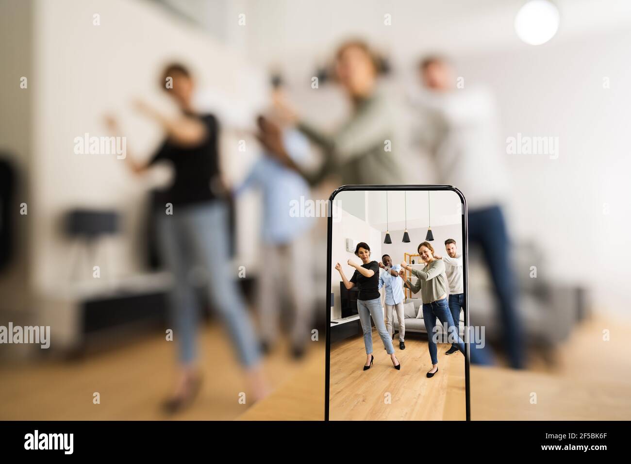 Young Happy Group Dance For Mobile Phone Video Stock Photo