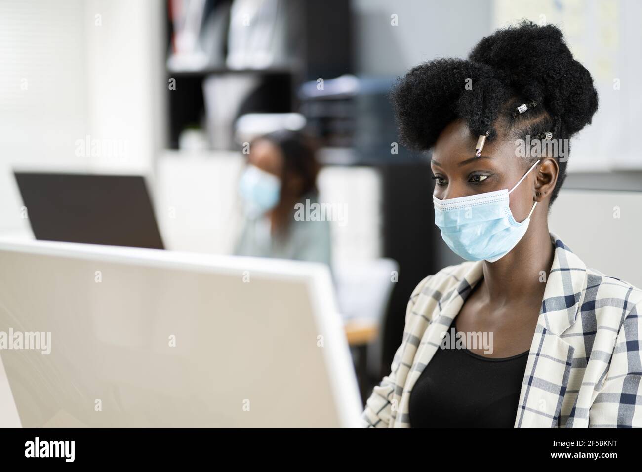 Business People In Medical Covid Face Masks Stock Photo