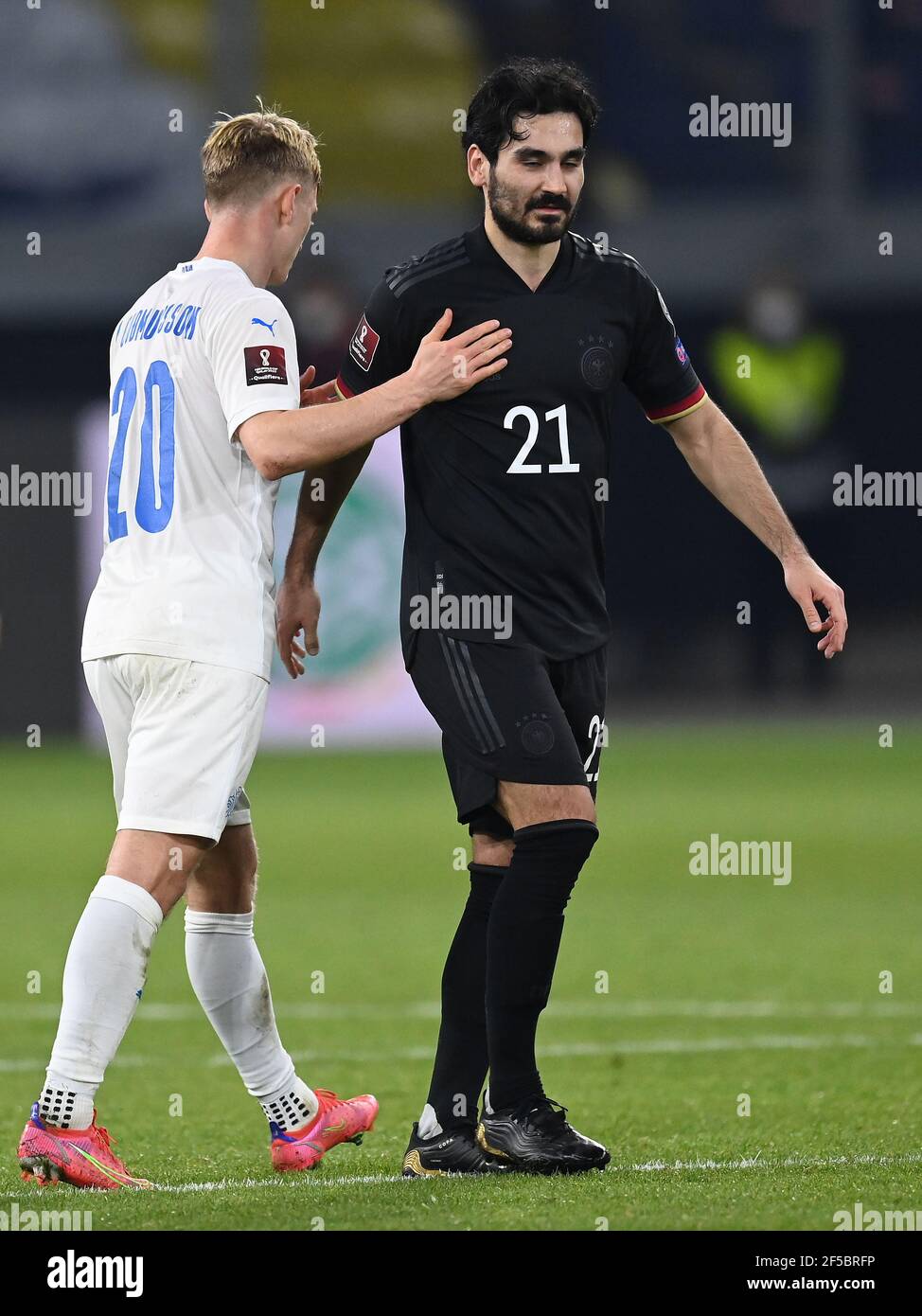 Duisburg, Germany. 25th Mar, 2021. Albert Gudmundsson (Iceland) and Ilkay Guendogan (Germany) after the game. GES/Fussball/WM-Qualifikation: Germany - Iceland, 25.03.2021 Football/Soccer: World Cup qualifying match: Germany vs. Iceland, Duisburg, Germany, March 25, 2021 | usage worldwide Credit: dpa/Alamy Live News Stock Photo
