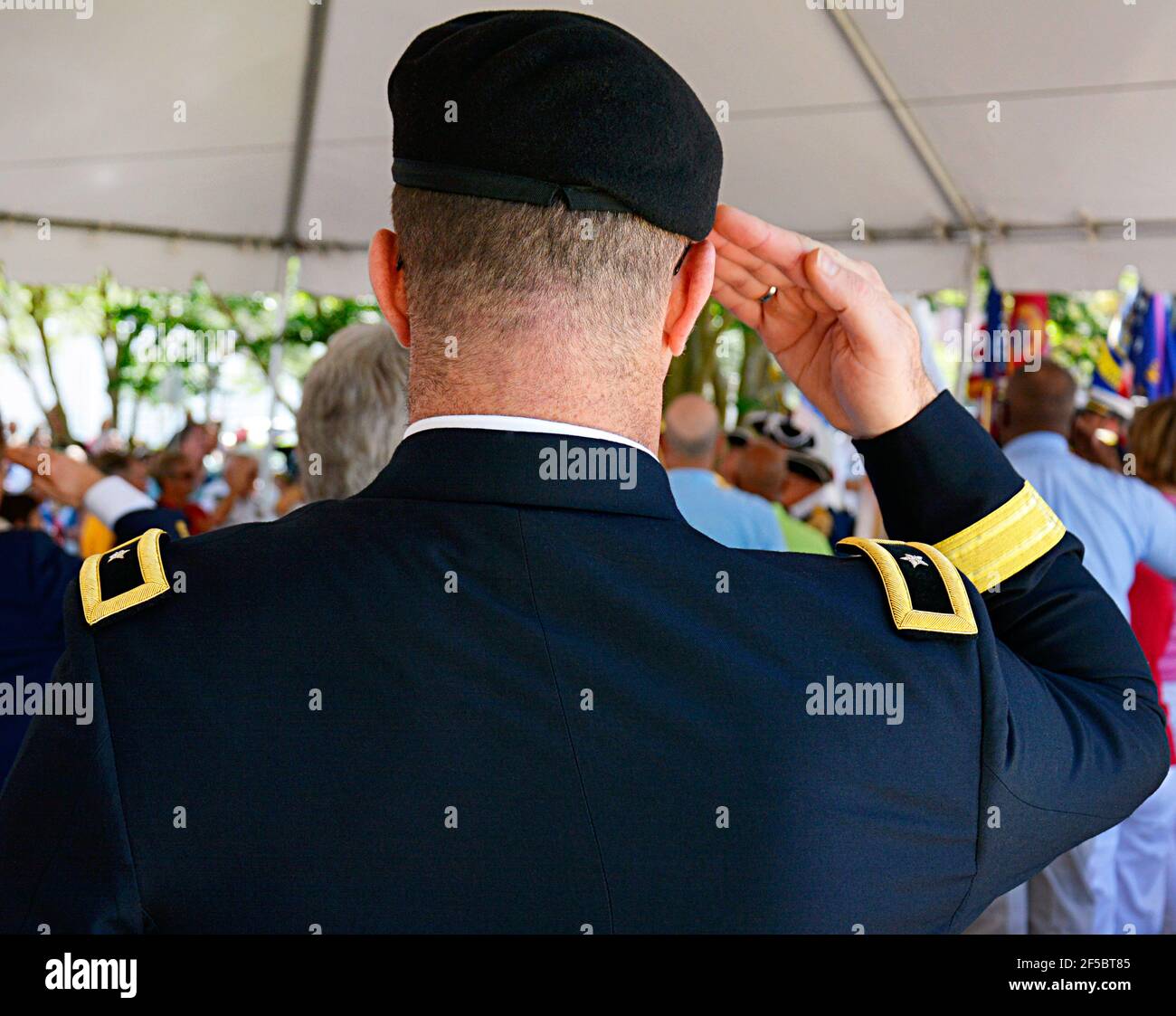 Rear view of a One Star General wearing his Service Dress uniform with the US Army sporting a beret and saluting at a Veterans Event in Sarasota, USA Stock Photo