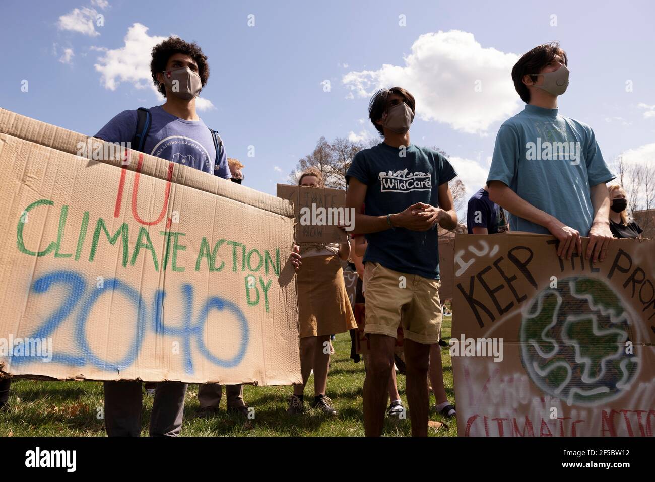 Protesters hold placards during the “Keep the Promise” rally in Dunn Meadow to advocate for Indiana University to reach carbon neutrality by 2040.Students for a New Green World, a student organization which works to combat climate change, and IU Student Government's environmental affairs committee organized the protest to advocate for climate change action at IU which took place in Dunn Meadow. The demonstration was organized in support of an IUSG resolution created by the environmental affairs committee which unanimously passed in IUSG congress on March 8. (Photo by Jeremy Hogan/SOPA Images Stock Photo