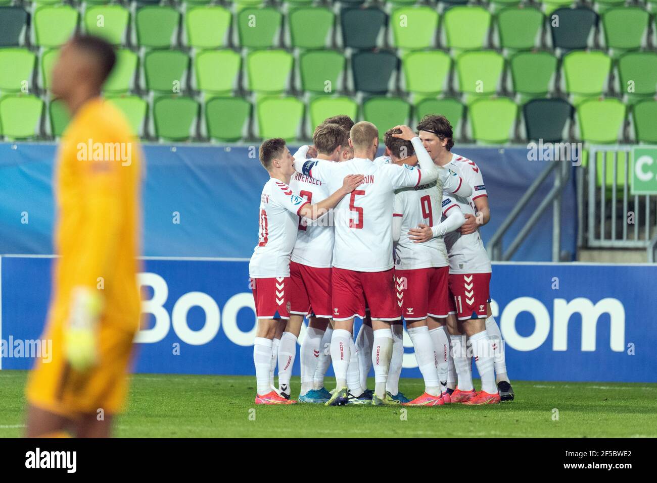 Szombathely, Hungary. 25th Mar, 2021. Anders Dreyer (11) of Denmark scores for 0-1 and celebrates with his team mates during the UEFA EURO U-21 match between France and Denmark at Haladas Stadium in Szombathely. (Photo Credit: Gonzales Photo/Alamy Live News Stock Photo