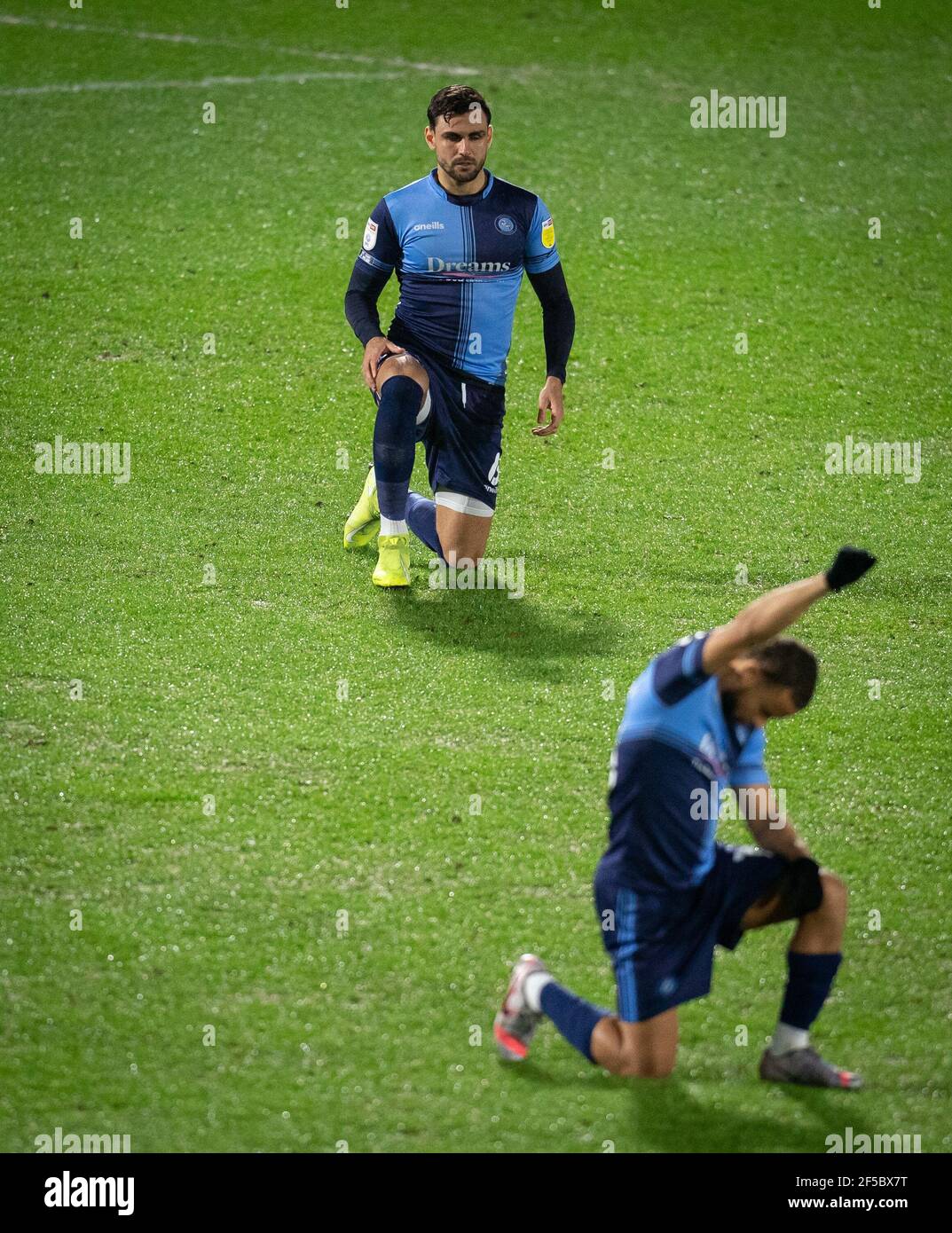 Ryan Tafazolli of Wycombe Wanderers takes a knee during the Sky Bet Championship behind closed doors match between Wycombe Wanderers and Birmingham Ci Stock Photo