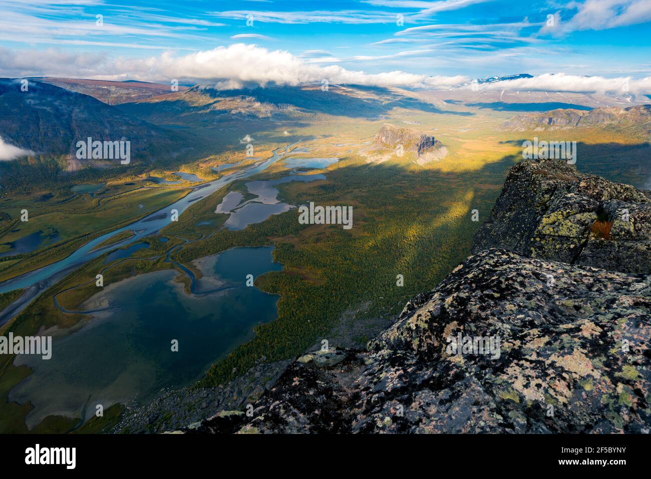Beautiful, wild arctic valley viewed from mountain top in epic early morning light. Remote Rapa river valley from the top of Skierfe in Sarek national Stock Photo