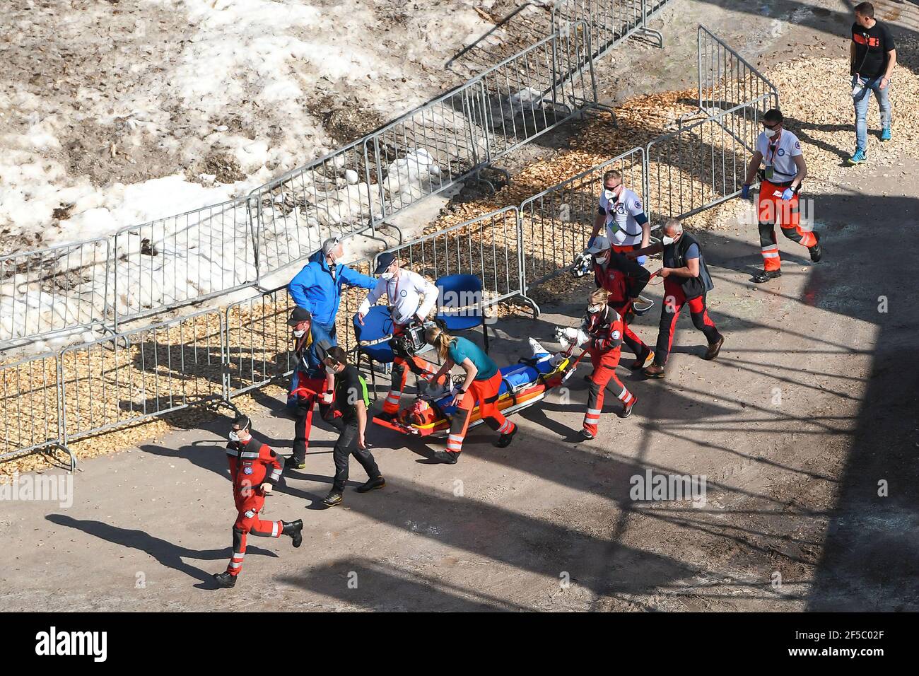 Medical staff provide assistance to Daniel Andre Tande of Norway after he crashes during the FIS Ski Jumping World Cup Flying Hill Individual competition in Planica. Stock Photo