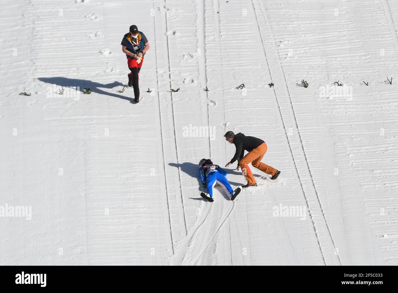 Medical staff provide assistance to Daniel Andre Tande of Norway after he crashes during the FIS Ski Jumping World Cup Flying Hill Individual competition in Planica. Stock Photo