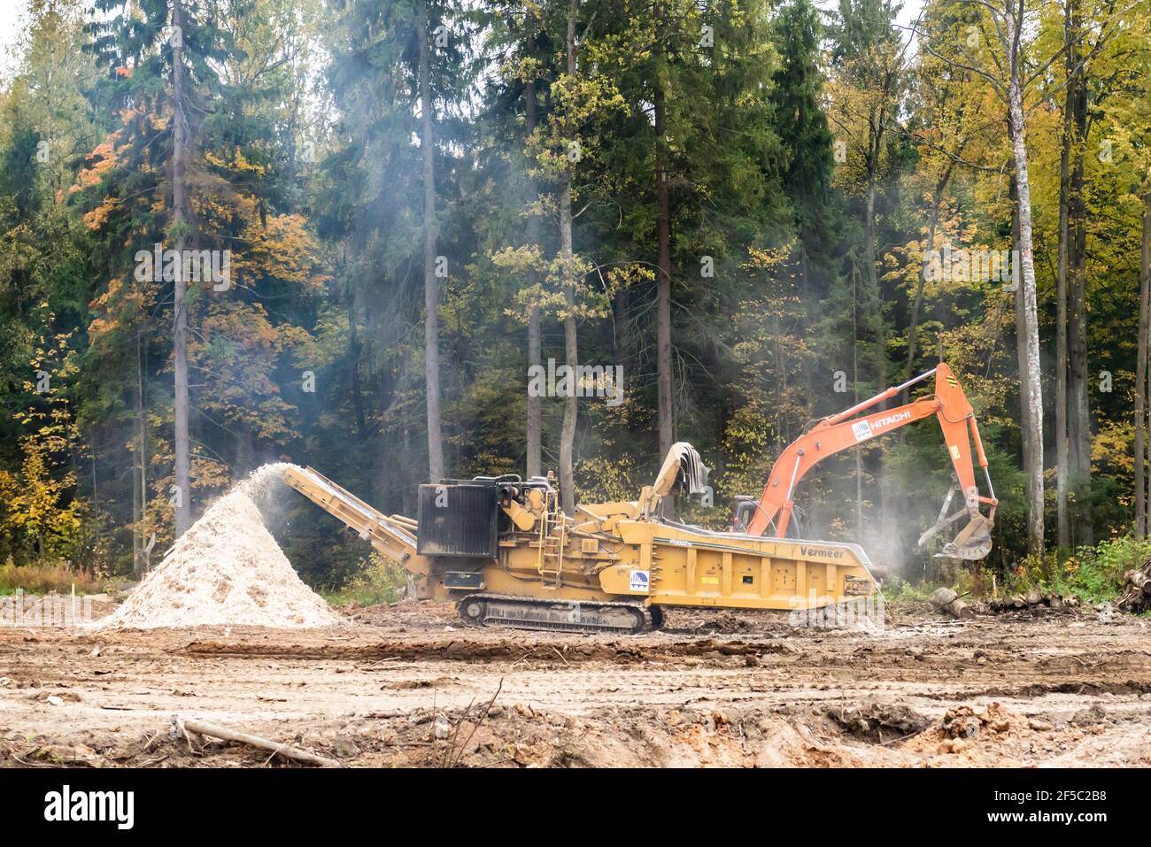 Moscow oblast. Russia. Autumn 2019. Industrial wood chopper at work. Construction of a large highway. Stock Photo