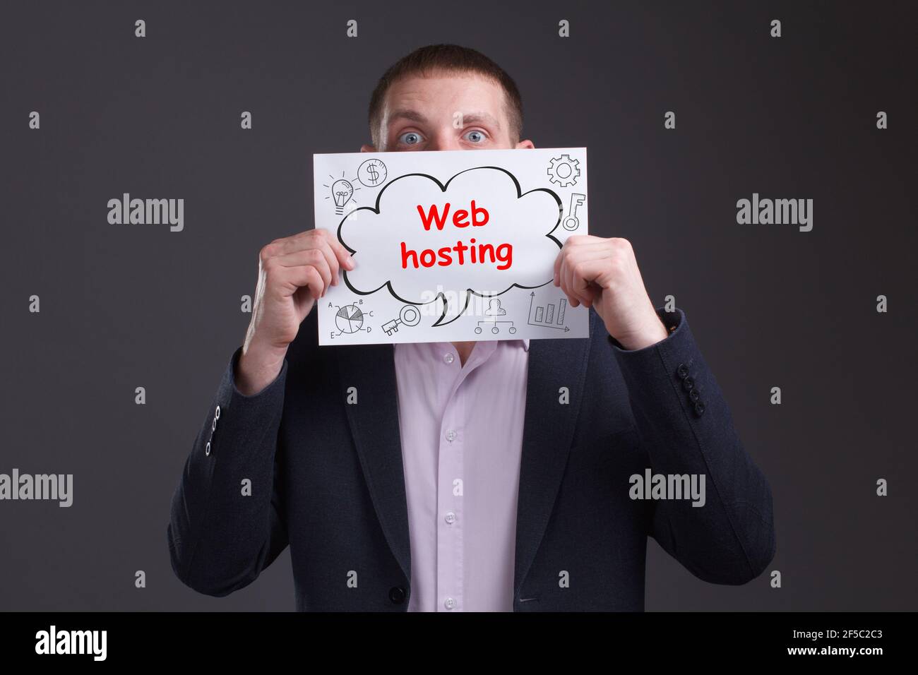 Business, technology, internet and network concept. Young businessman thinks over the steps for successful growth: Web hosting Stock Photo