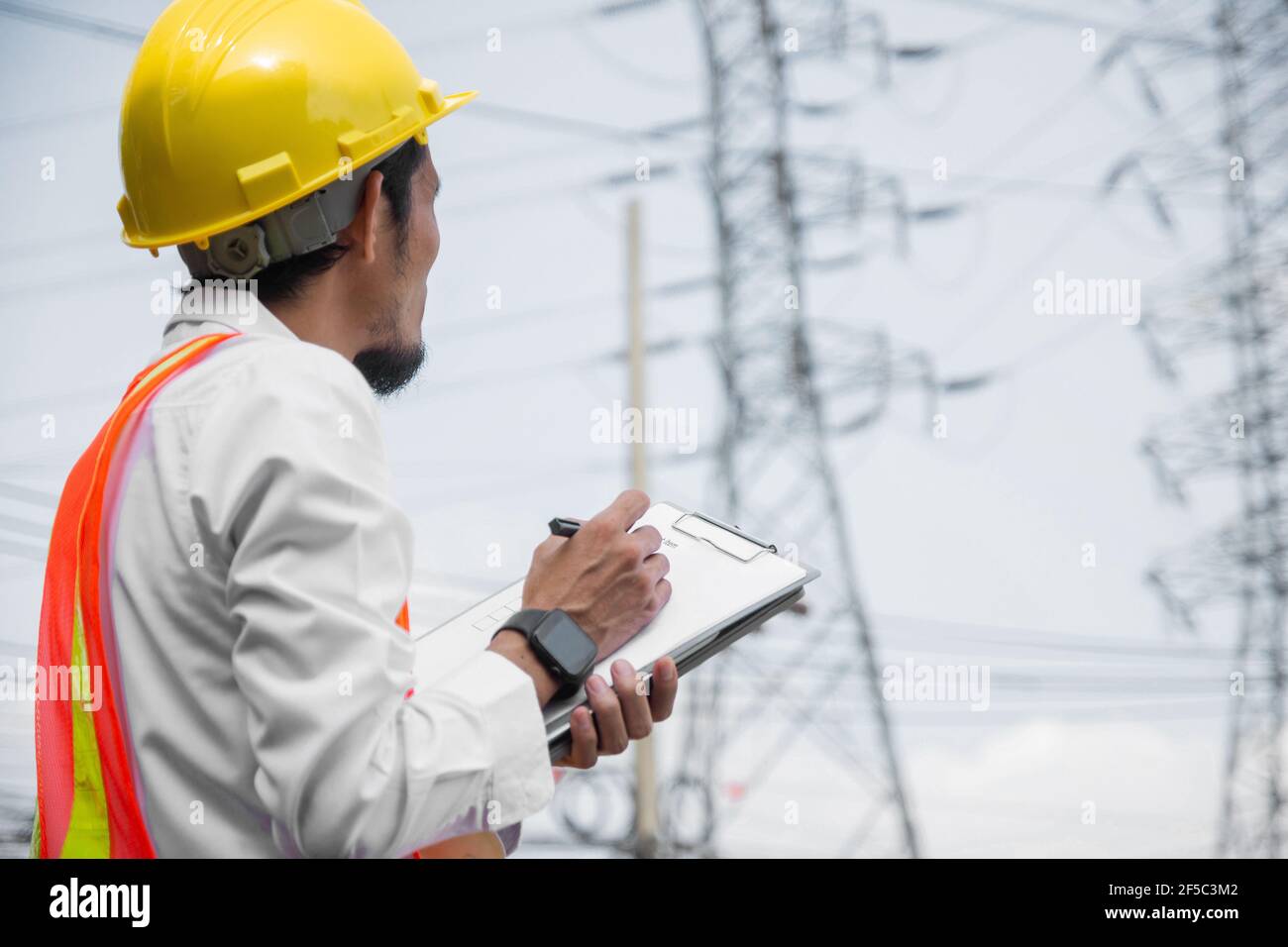 Engineer inspection high voltage tower record on check list, Engineer