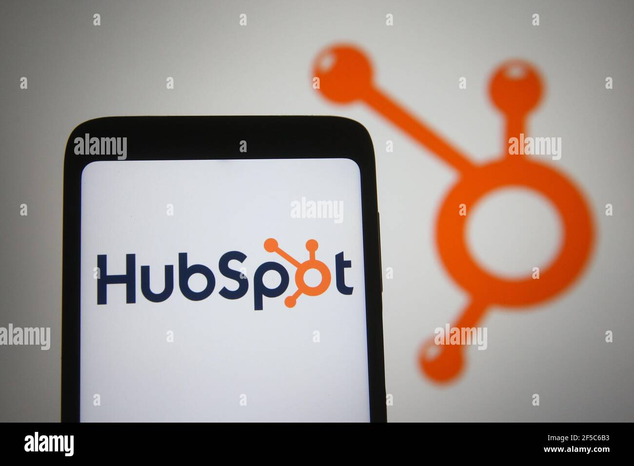 In this photo illustration the HubSpot logo of an US software company