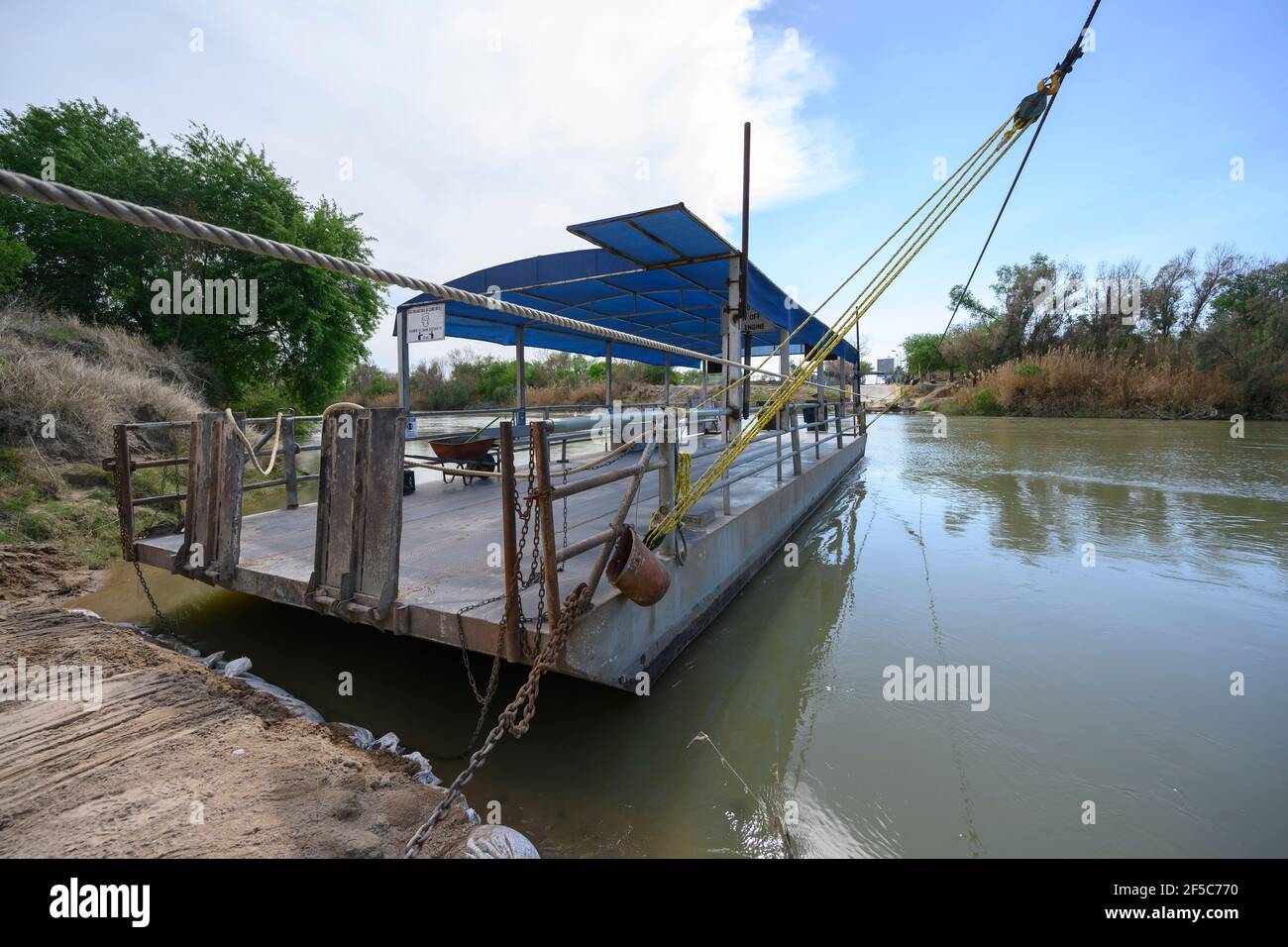 Los Ebanos, Texas, USA. 25th Mar, 2021. The handdrawn ferry on the Rio