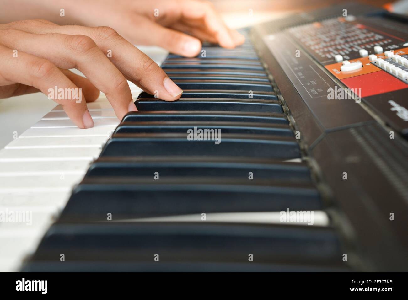 fingers on piano keys Stock Photo Alamy