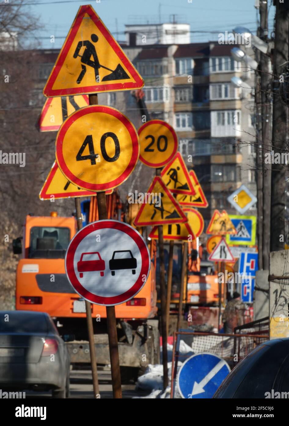 Under construction - Road signs along street Stock Photo - Alamy